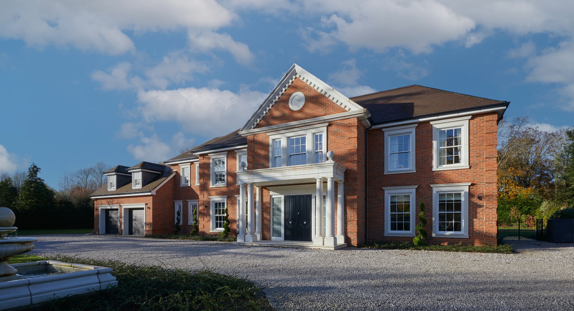 Classic brick residence under an open sky