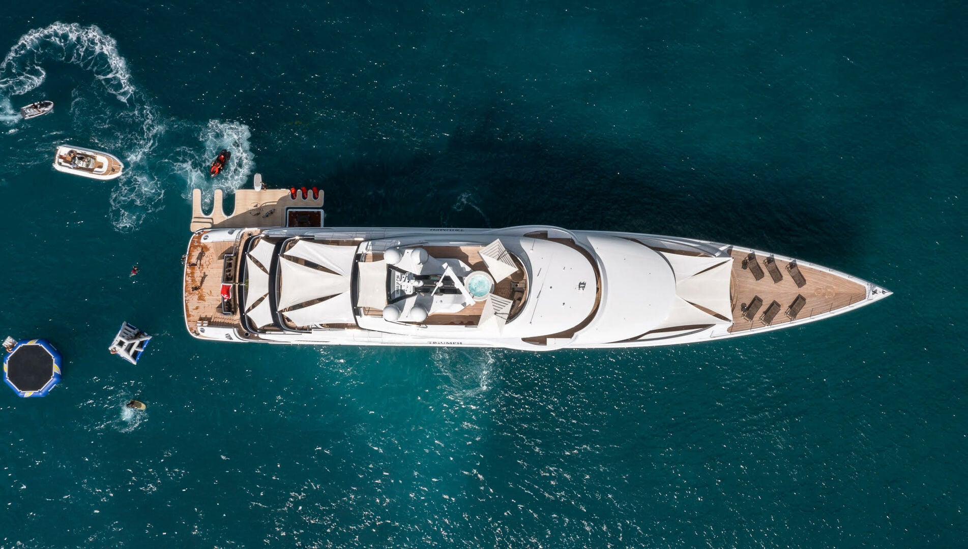 Superyacht Triumph seen from above in clear water